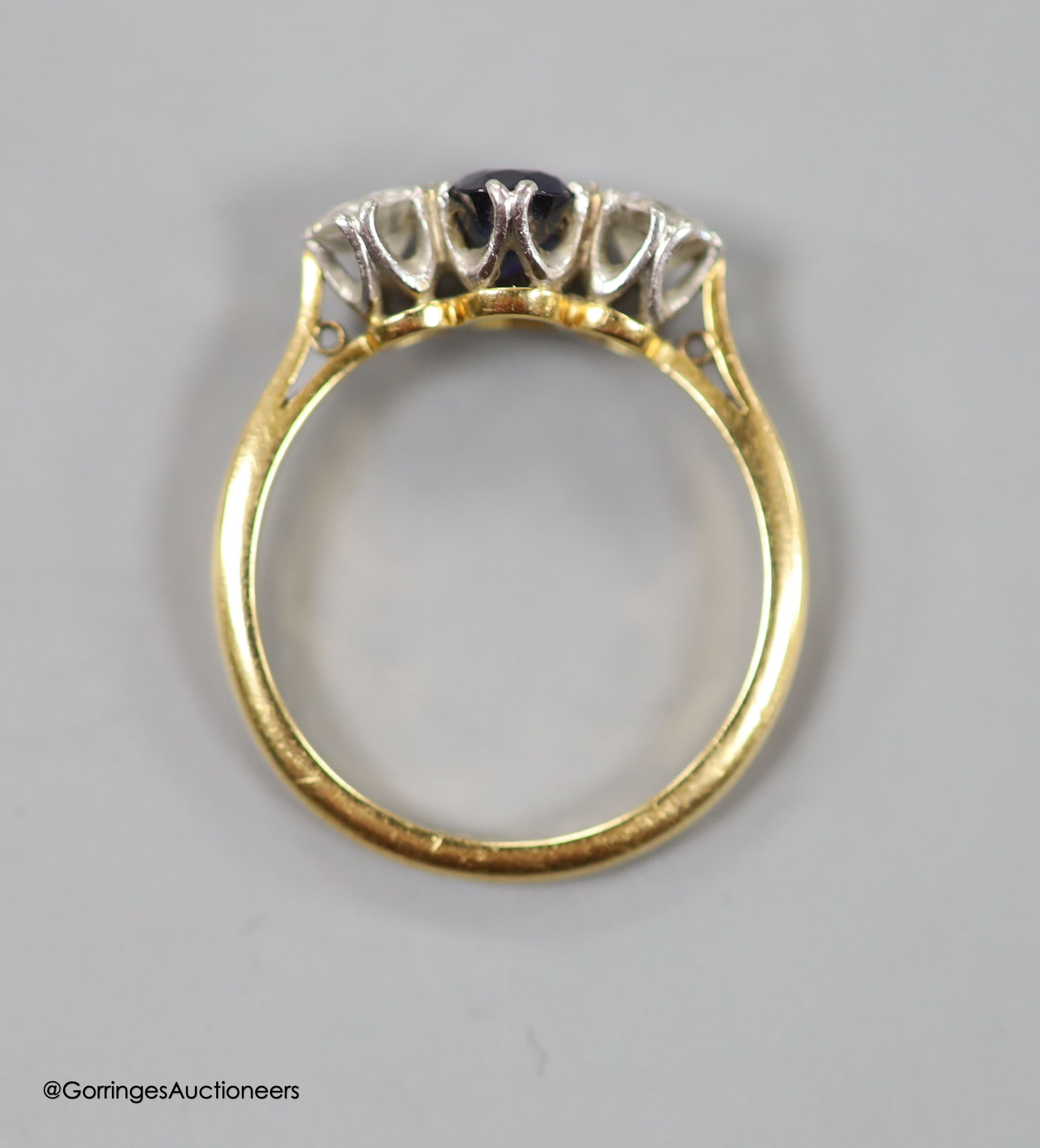 An 18ct & plat, sapphire and diamond three stone ring, size O, gross weight 3.4 grams